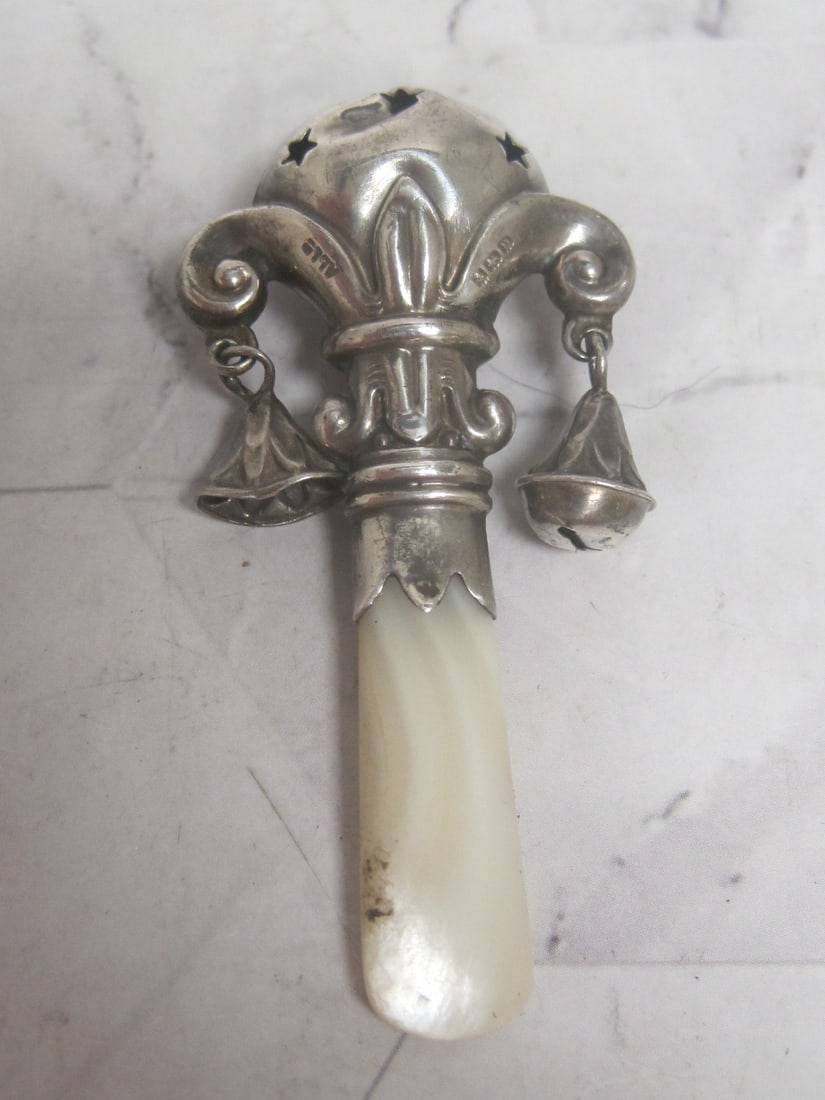 Antique Sterling Silver Baby Rattle: Mother of pearl handle, English hallmarks, circa 1910, tough baby caused dents & dings