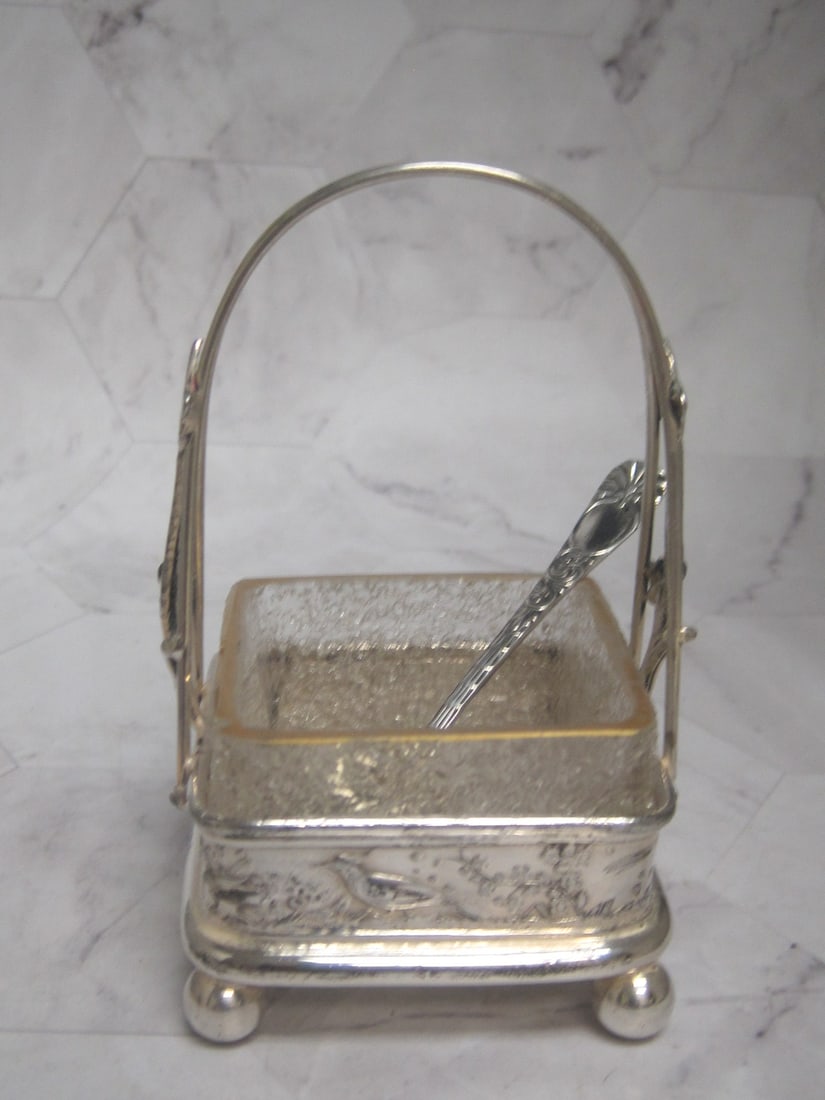 Victorian Silverplate Salt Cellar: 4 1/2" tall, With art glass textured glass insert, tall basket handle, bird & floral dÃ©cor, with spoon