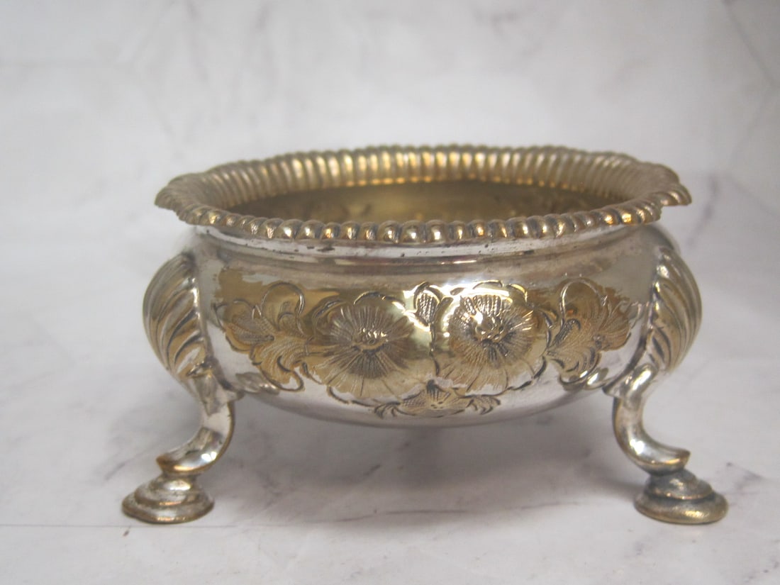 English Victorian Master Salt Cellar: 3 1/4" diameter, Tri-footed floral repousse, gadroon border, silverplated