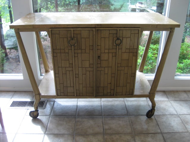 Johnson Furniture Co. Forward Trend Midcentury Portable Server: 42" x 18" x 29 1/2", two locking doors with dovetail drawer inside, has lock and key, server needs refinishing-finish is flaking and has water stains, Local Pickup Only