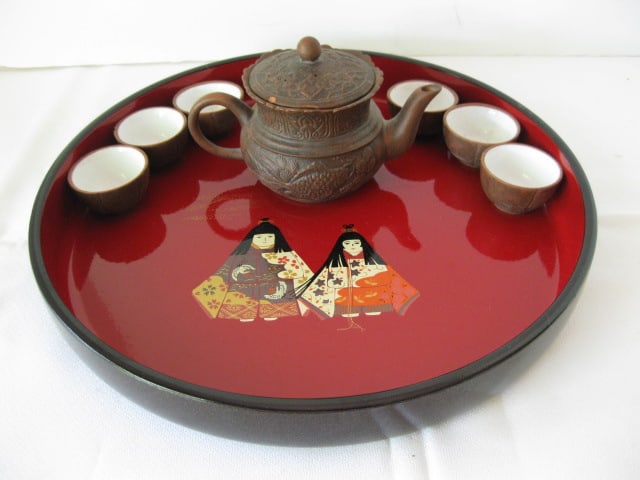 Lacquered Chinese Serving Tray and Brown Clay Tea Set: Tray 11 3/4"dia x 1 1/2"h, teapot 3 1/2"h-small chip on lid, (6)1"h tea cups-one has chip