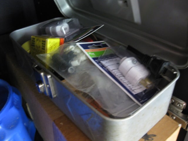 Contents of Garage Storage Cabinets-Light Bulbs, Coolers, Step Stool, Jacks, Cleaners, etc. - 18