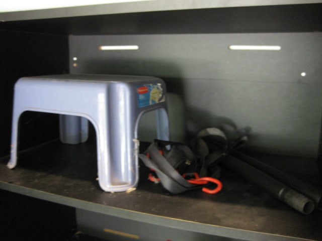 Contents of Garage Storage Cabinets-Light Bulbs, Coolers, Step Stool, Jacks, Cleaners, etc. - 7