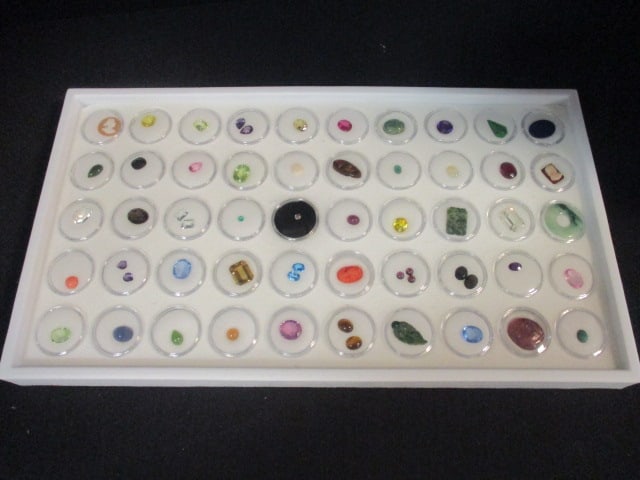 Jeweler's Estate 57 Cut Gemstones and Related Stones in Snap Cases: Gemstones include diamond, emerald, ruby, sapphire, blue topaz, opal, amethyst, citrine, jade, cameos and much more. See all pictures and preview for stones cut and size
