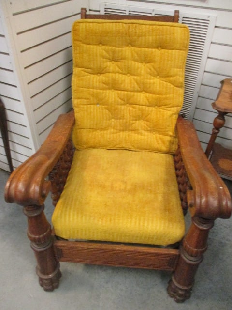 Antique Victorian Eastlake Influenced Platform Lounge Chair: 29 1/2"w, turned spindle arm supports, scroll arms with turned post feet, yellow velour seat cushions, back missing one button cover, Local Pickup Only