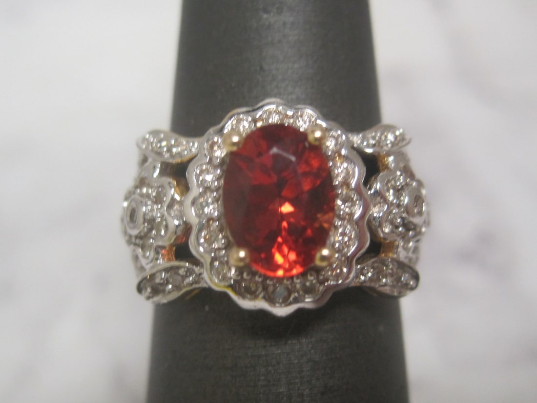 14k Gold Madeira Citrine and Diamond Ring with Diamonds: Vivid Orange Red Oval Gem, 1.25 Carat with 54 round diamonds totalling .50 carats. Size 6 1/4. Appraised at $1750. See Appraisal Photos for Specs