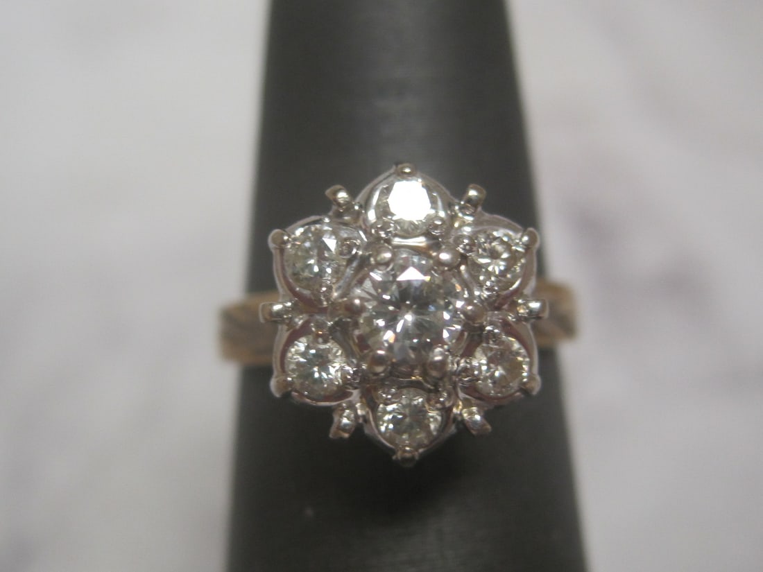 14k Gold Diamond Ring: 7 Round Diamonds in floral design, totalling .38 carat, Size 5. Appraised at $1550. See Appraisal Photos for Specs