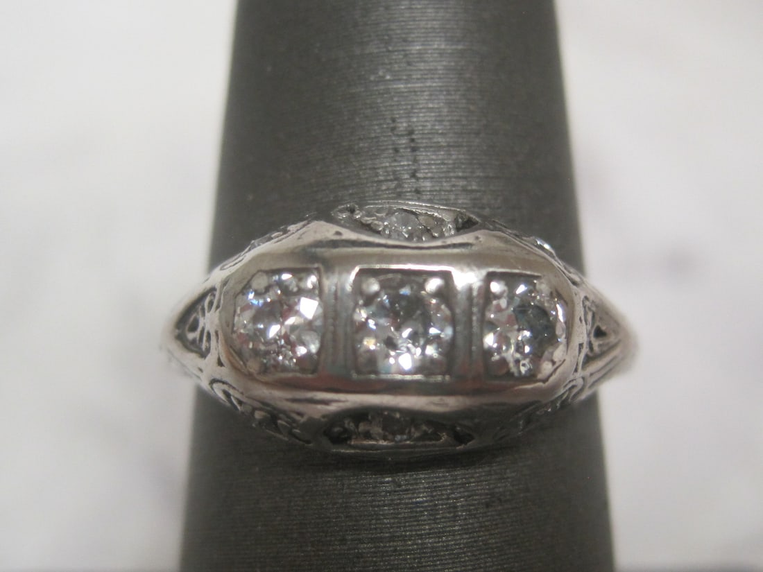 Antique 19k White Gold Diamond Filigree Ring: 9 round diamonds totalling .45 carat, high grade, Size 7 1/2. Appraised at $1850. See Appraisal Photos for Specs