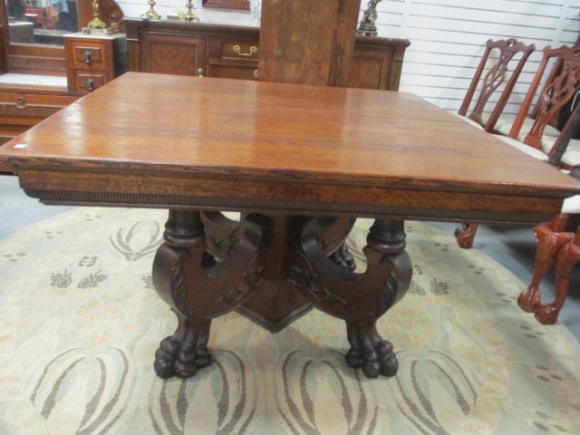 Antique Victorian Eastlake Quarter Sawn Oak Pedestal Table and Two Leaves: Table 48" x 47 1/4" x 29 1/2", (2)12" leaves, Beautifully carved claw foot table base, leaves have some splits and water marks, Local Pickup Only