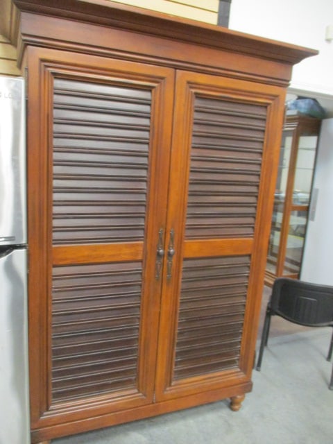 Tommy Bahama by Lexington Louver Door Multi-Use Cabinet: Distressed 2 tone cabinet, 58" x 25 1/2" x 82", interior has seven drawers, open shelf, two long adjustable shelves and power strip. Back panel has factory gromet for cables, back panel intact, could