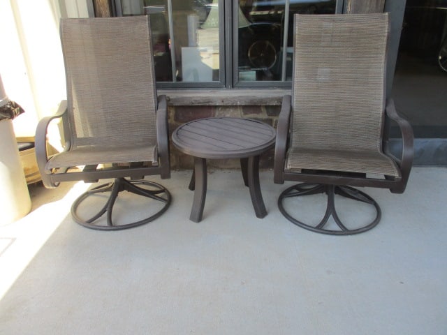 Pair of Tropitone Bronzed Metal Frame Armchairs and Round Side Table: (2)24 1/2" Swiveling high back bouncy chairs, (1)24"dia x 18 1/2"h side table, Local Pickup Only
