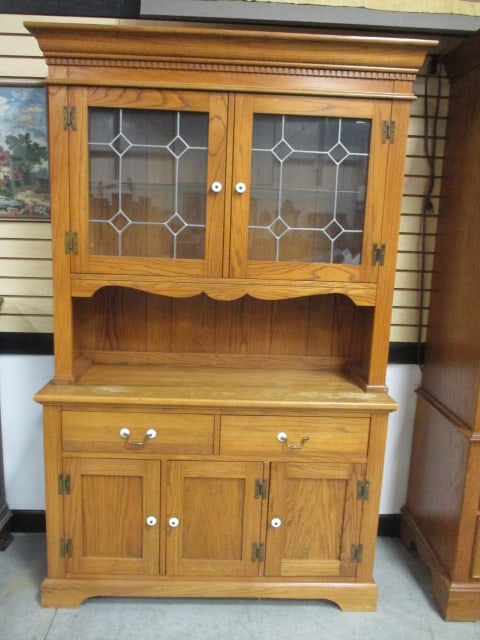 Rex Furniture Co. Rex, Ga. Oak Farmhouse Style 2 Piece China Hutch: Base 48 1/2" x 18" x 32", Leaded Glass Style Door China Hutch 50 1/2"(crown to crown) x 14 1/2" x 46", Base has two drawers over three doors, China hutch has adjustable plate groove shelf, Dentil crow