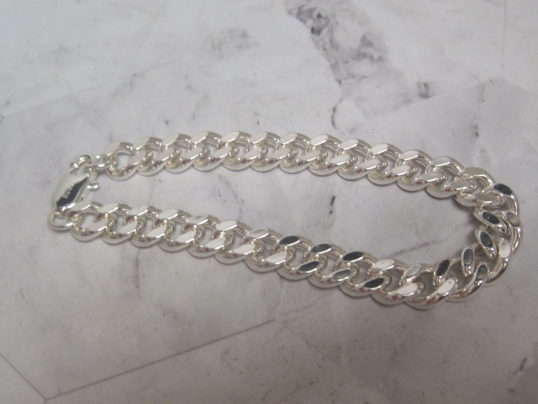 8" Sterling Silver Bracelet: Weighs 27.6 grams