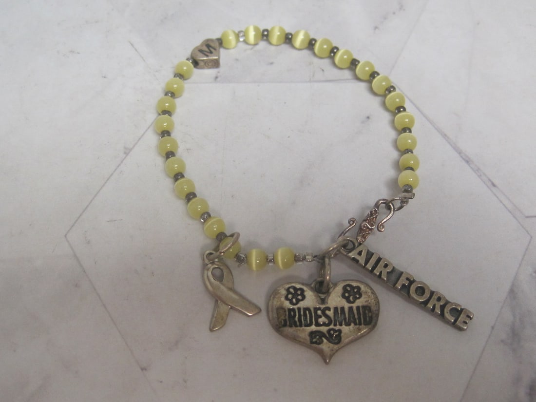 Yellow Bead Bracelet with Sterling Silver Charms: .