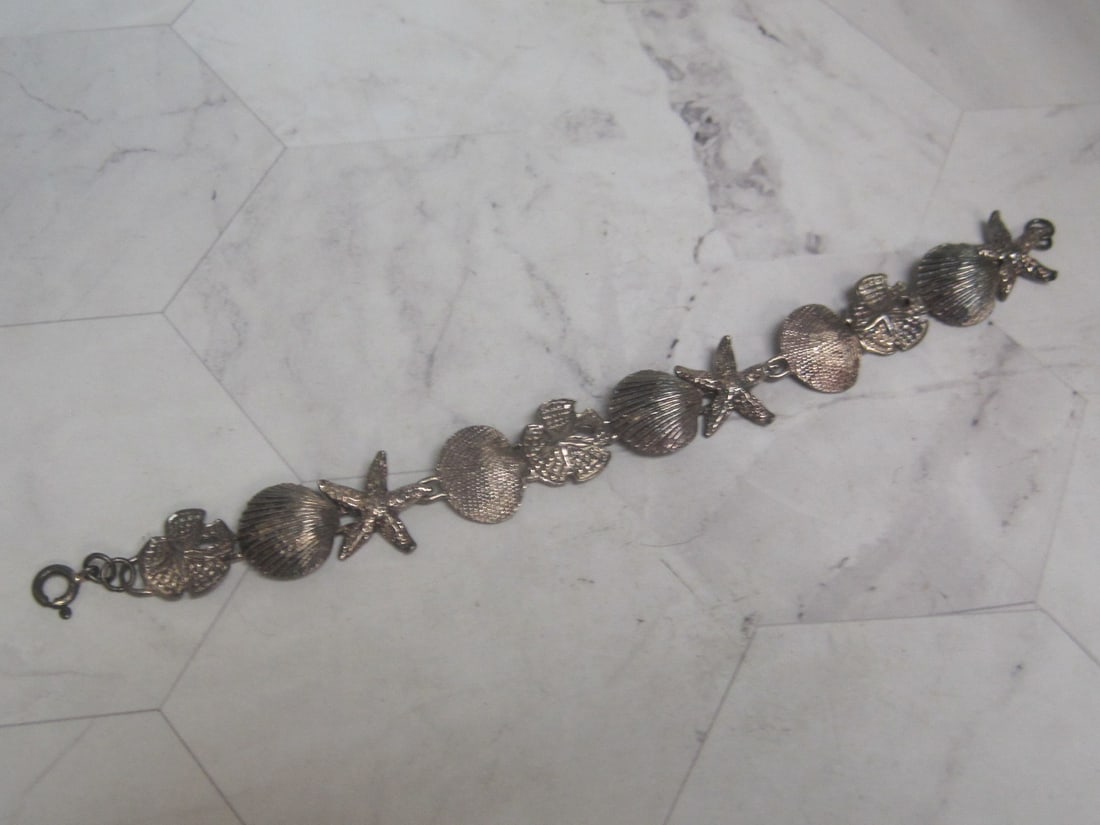 7 1/2" Sterling Silver Seashell Bracelet: Weighs 16 grams