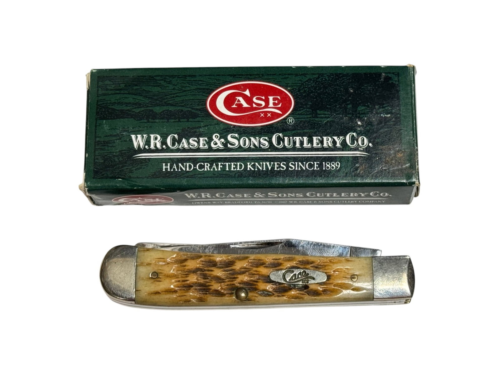 CASE XX 6254 SS Trapper Amber Bone 2-Blade Pocket Knife in Box: Item No. 00164 | Blade looks to be new in box but needs cleaning and has a few minor specs of rust on blade, see photos.