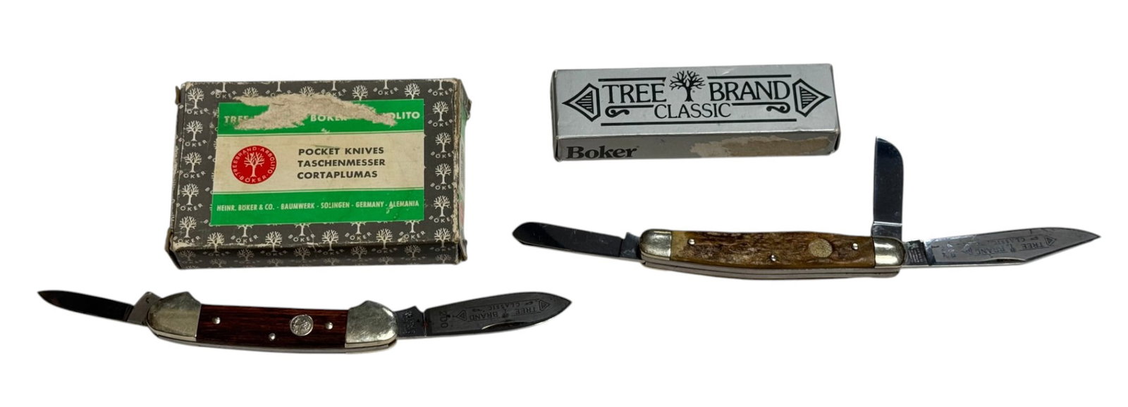 (2) Boker Tree Brand Pocket Knives with Boxes: (1) #4474 - Missing medallion, (2) #200 - Both have boxes and both show some storage wear with minor surface rusting but overall good.