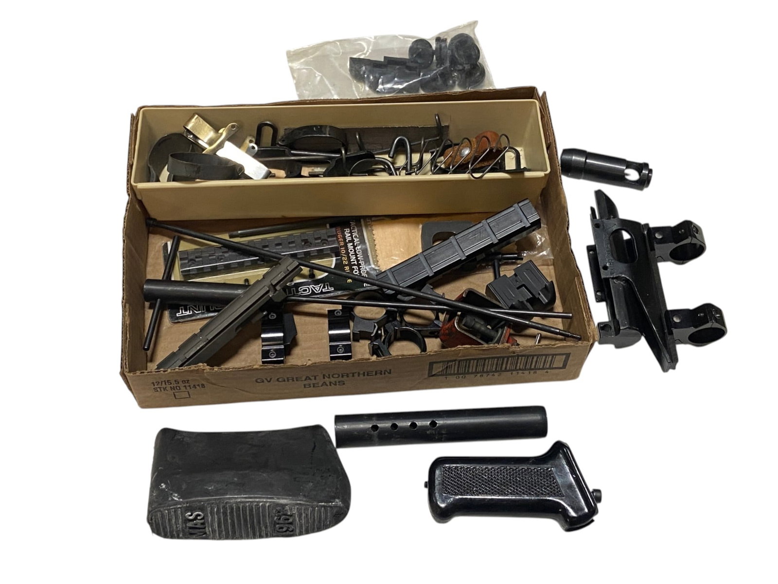 Various Parts (See Photos): French 1962 MAS Butt Pad, AK47 Grip, M16 Blank Device, Scope Rings, AK47 Flash Device, Sling Swivel, and more.
