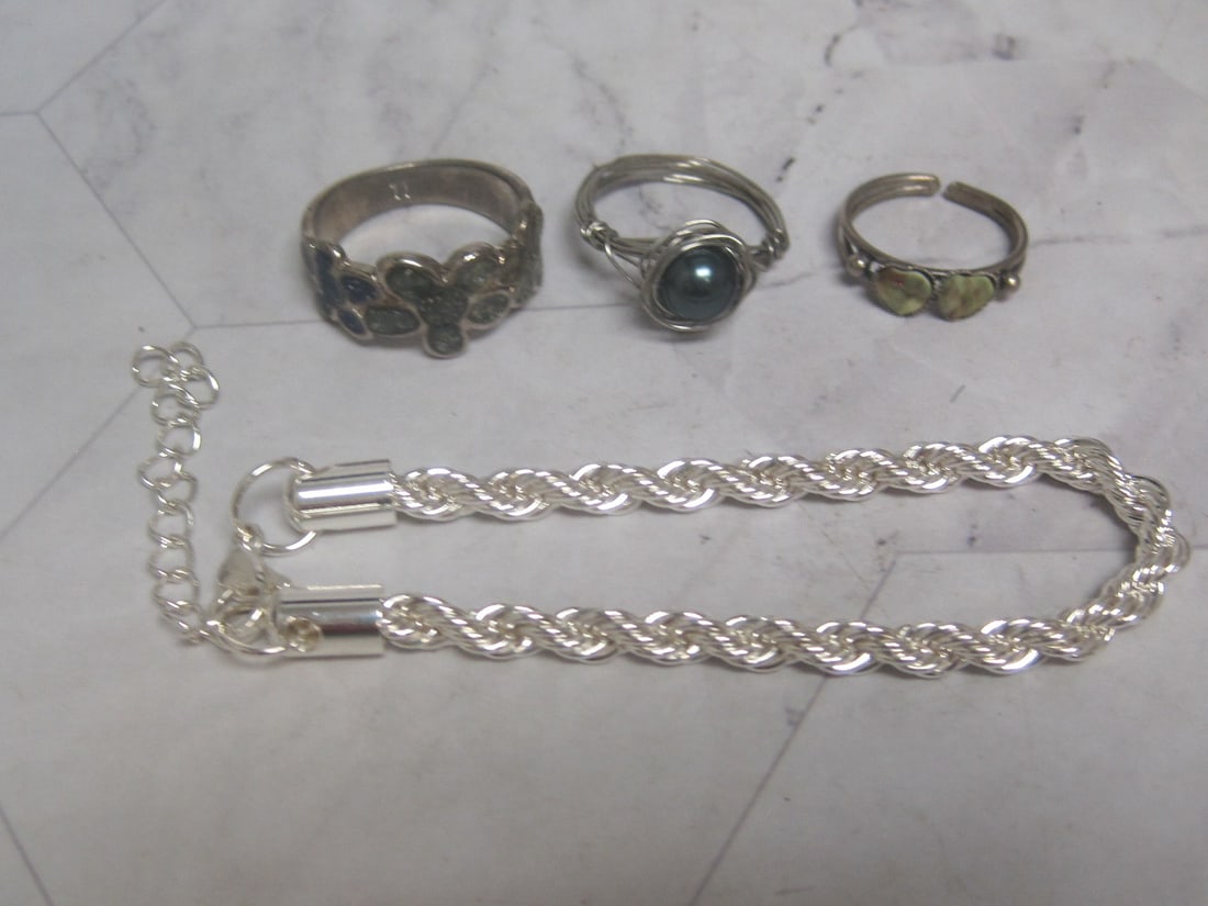 Lot of 3 Silvertone Rings & Bracelet: .