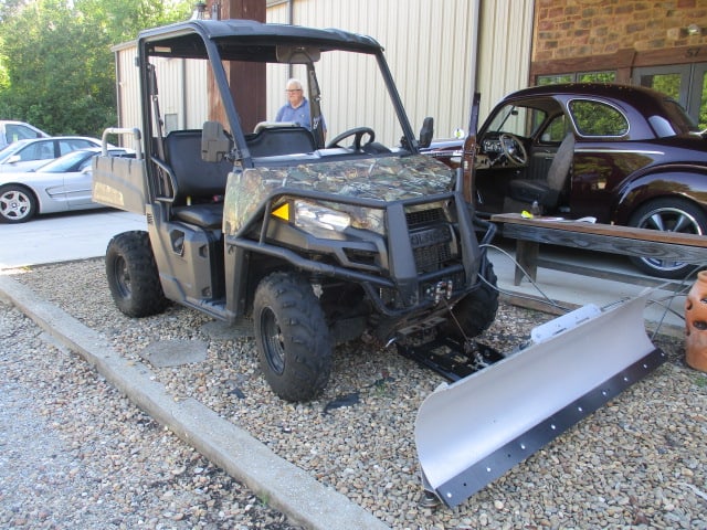 2015 Polaris Ranger 570 MidCamo Side by Side with KFi Snow Plow Blade: Ranger has front winch with bush guard, has dump bed and Haulmaster hitch extender, Odometer reads 2,181 miles, has headlights, rear view and side view mirrors, seat belts, Model R15RMA5AC, Serial#