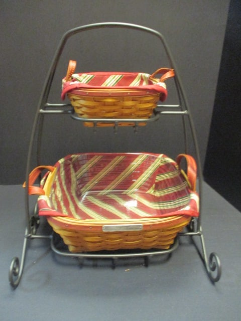 2 Longaberger Baskets on 2-Tier Wrought Iron Holder with Fabric and Plastic: Inserts, 6" x 6" x 3" and 11" x 11" x 5", signed and numbered