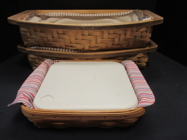 3 Longaberger Casserole Baskets with Fabric Inserts and 2 Plastic Containers: with Lids, 11" x 9" x 3" and (2) 18 1/2" x 12" x 3 3/4", signed and numbered