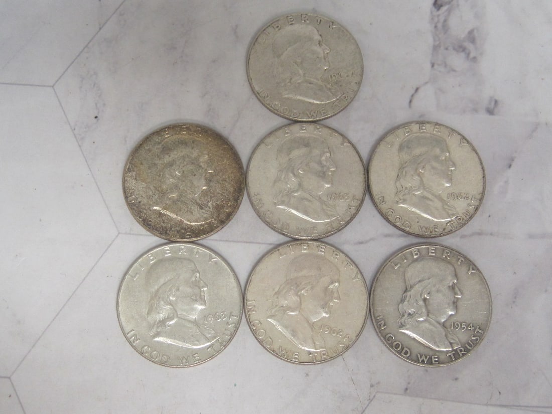 Lot of 7 Franklin Half Dollars (1 of 3)