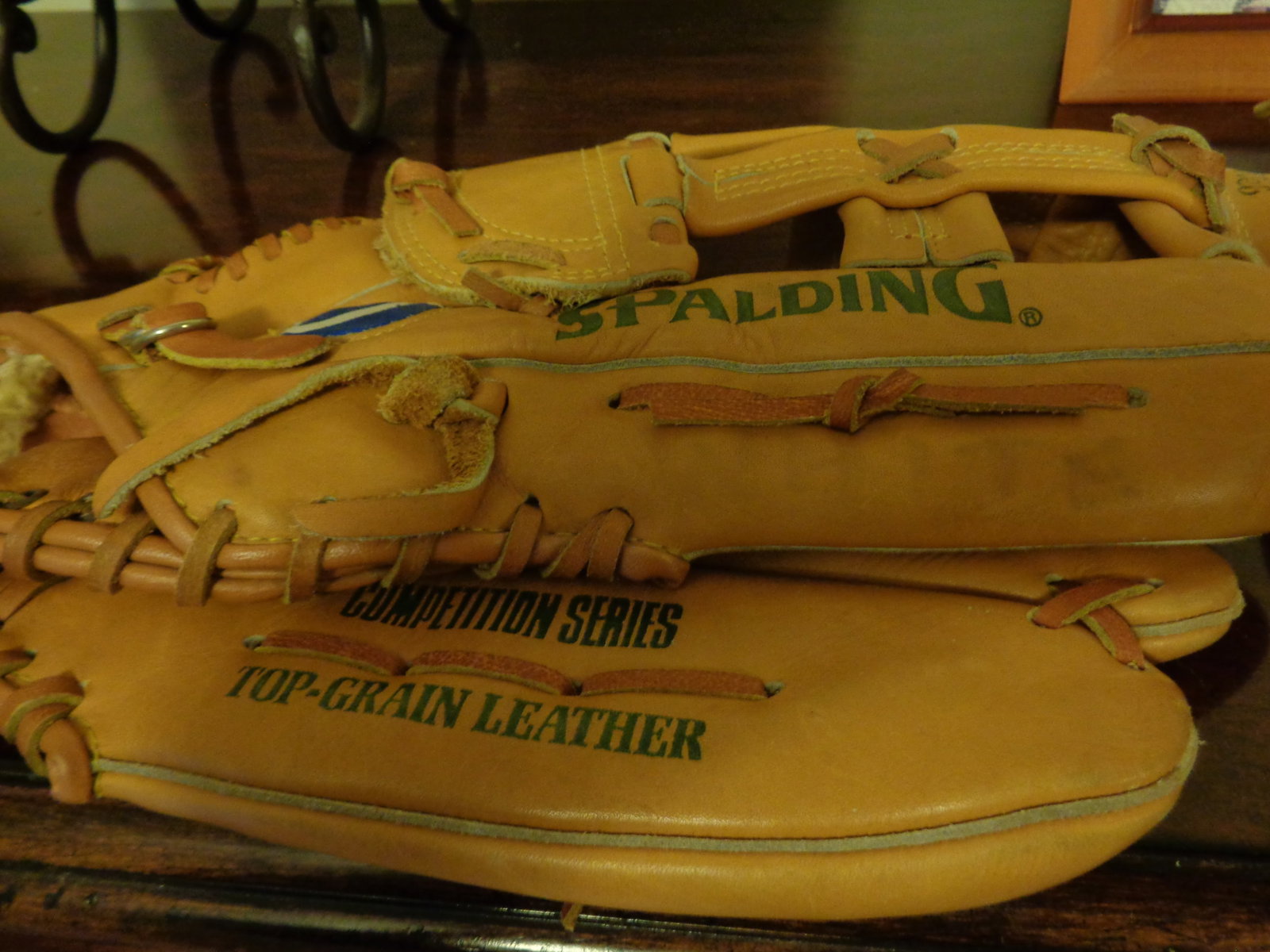 2 older baseball gloves - 2