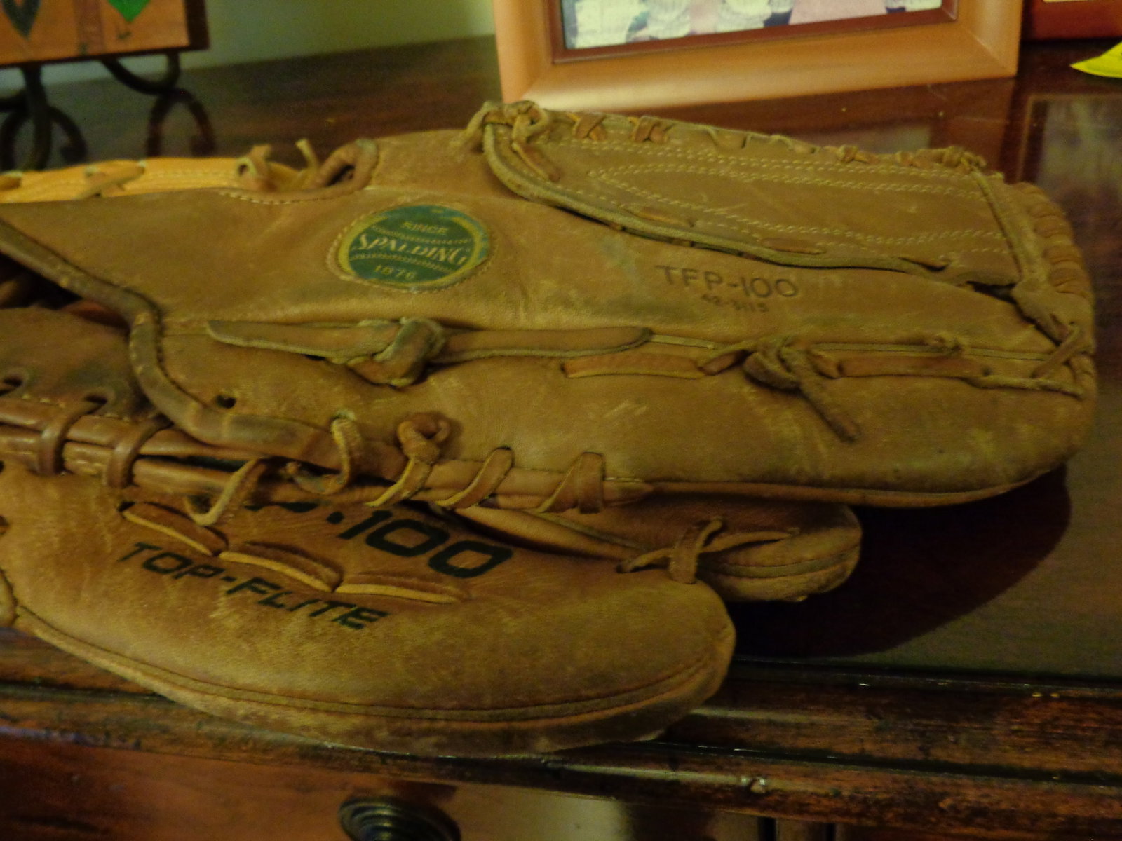 2 older baseball gloves - 3