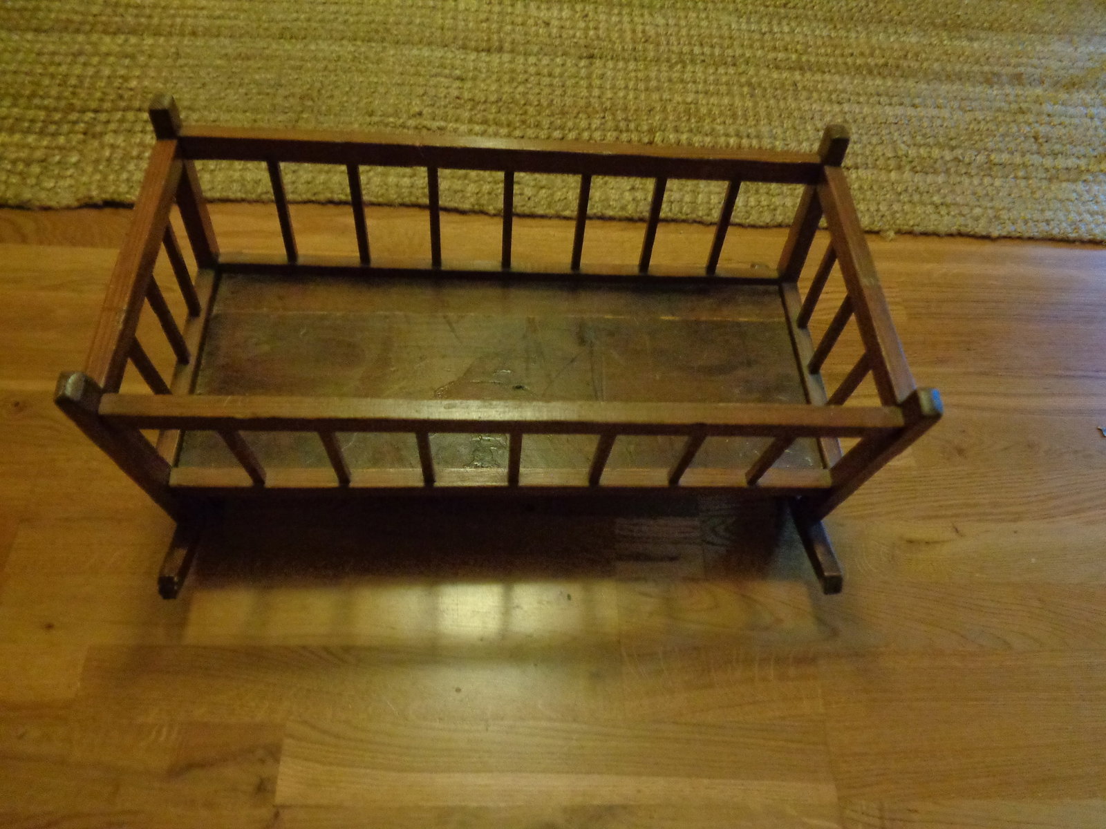 wooden Doll Cradle: Bottom slats loose, side has small crack 25x12x12 1/2