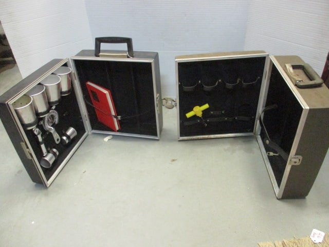 Two Midcentury Travel Bar Cases: Black case has lock and key and has some bar tools, brown one is case only