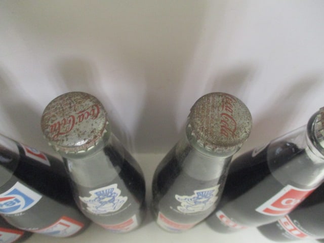 Grouping of 7 Unopened Commemorative Coca-Cola Bottles - Furman, Olympics, - 7
