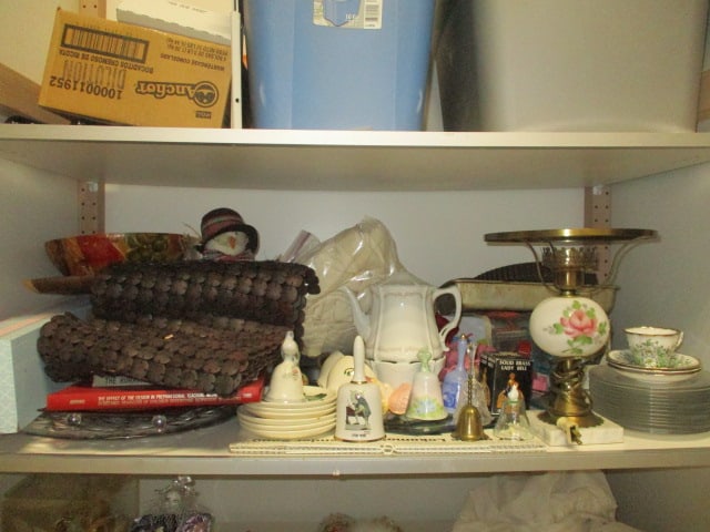 Shelf Lot - Porcelain Electrified Oil Lamp, Glass Plates, Bells, Cookware,: Wood Bowl, Christmas Decorations, etc., please bring boxes and packing supplies, Local Pickup Only