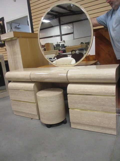 Postmodern Faux Travertine Laminate Waterfall Design 5 Piece Vanity Set with Gold Accent Bands: Set includes 3 drawer waterfall top(68"x 16 1/2" x 6 1/4", Pair of 2 drawer support cabinets(22" x 17 1/4" x 23 1/4", Mirror 37"dia and Rolling round stool(15 1/4"dia x 18 1/4"), made in Brazil,