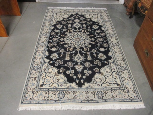 Ivory Border Navy Center Medallion Floral Design Wool Accent Rug: approx. 50" x 81"(not including fringe), few frayed spots on edge binding, Local Pickup Only