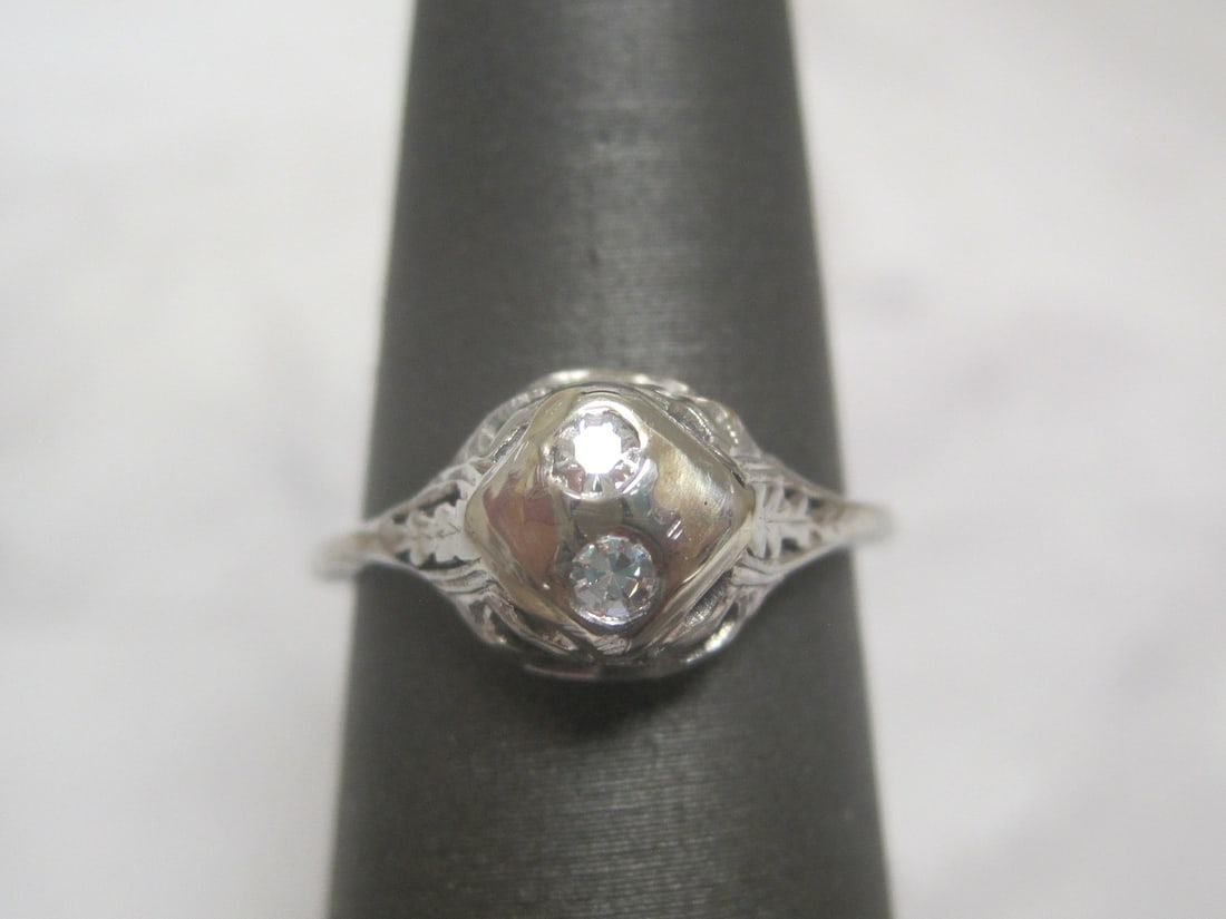 18k White Gold Antique Diamond Filigree Ring: Weighs 2 grams, Size 5 1/2, 2 small round diamonds in fancy openwork