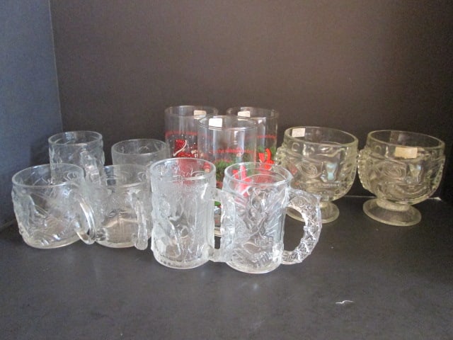 Collection of Licensed Character Collector Glassware: McDonald's "Batman" and "Flintstone" Movie Cups, Coca-Cola American Greeting "Holly & Robby" Glasses, Tiki Totem Steins