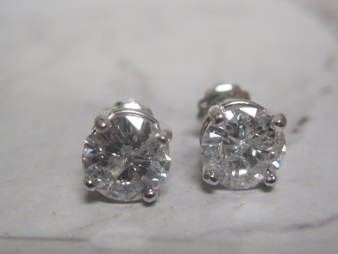Platinum 2.40 CT TW. Diamond Solitaire Earrings appraised at $6,275 - 2