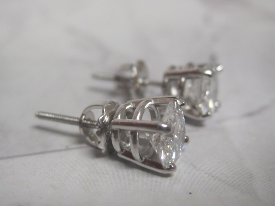 Platinum 2.40 CT TW. Diamond Solitaire Earrings appraised at $6,275 - 3