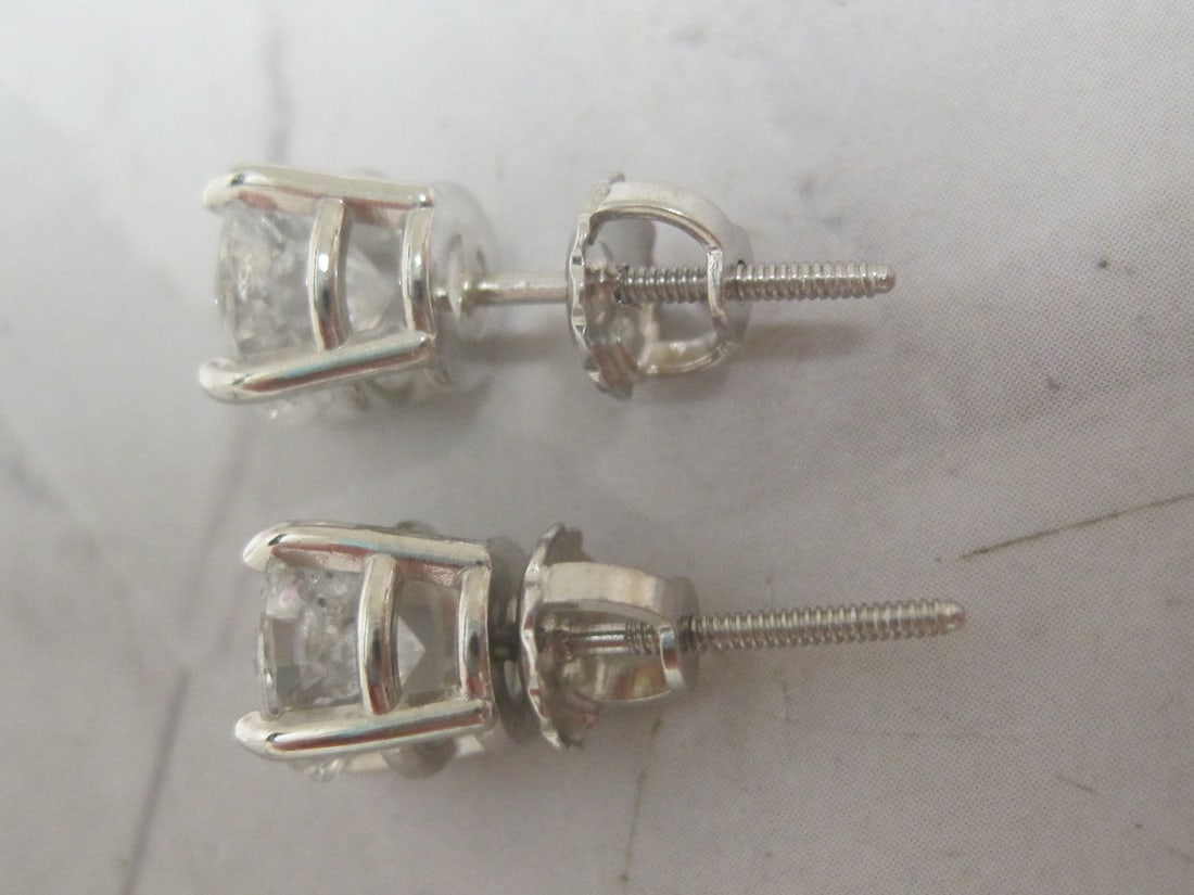 Platinum 2.40 CT TW. Diamond Solitaire Earrings appraised at $6,275 - 4