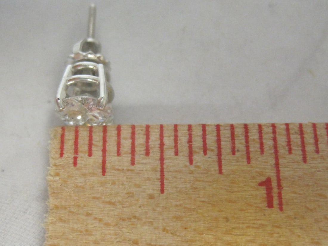 Platinum 2.40 CT TW. Diamond Solitaire Earrings appraised at $6,275 - 5