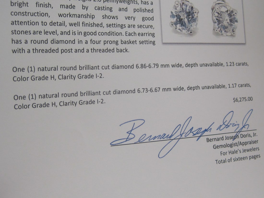 Platinum 2.40 CT TW. Diamond Solitaire Earrings appraised at $6,275 - 8