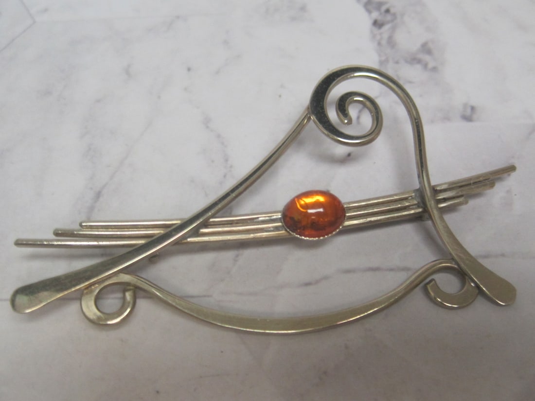 Sterling Silver Brooch with Amber Stone: Weighs 11.9 grams