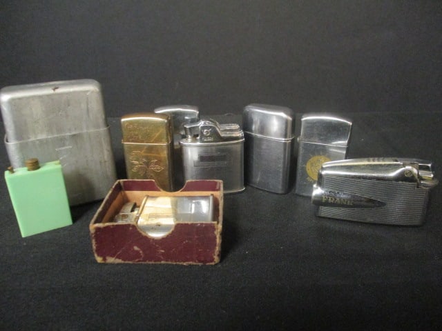 Eight Lighters and Aluminum Cigarette Box: (3)Zippos, (4)Ronsons, (1)Permanent Match