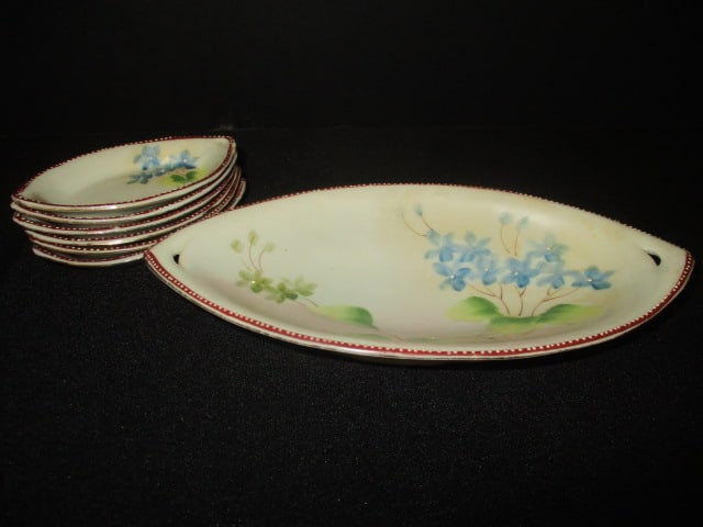 Antique Nippon Porcelain Salts and Celery Dish: (6)3 3/4" salts, (1)8" celery dish, marked Scranton, Pa. likely decorated in USA per consigner note