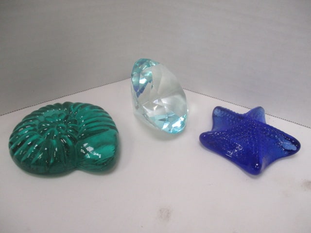 Three Art Glass Paperweights: Kitras Starfish and Ammonite Paperweights and Faceted Blue Crystal Paperweight