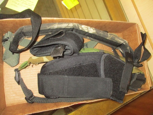 Grouping of Holsters and Slings: Belly holster, black hawk size 5 holster, ankle holster, Butler Creek Sling and two un-branded slings