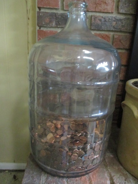 Old Glass Car Boy with Pennies: 19"h, about a quarter of way filled with pennies, Heavy! Local Pickup Only