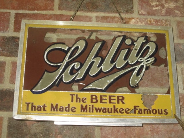 Vintage "Schlitz The Beer That Made Milwaukee Famous" Reverser Printed Glass: Advertisement Sign. 14 3/4" x 10"(not including hanging chain), some age wear to graphics