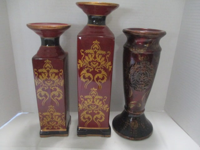 Three Burgundy and Black Pillar Candle Holders: (2)12"h, (1)14 1/4"h